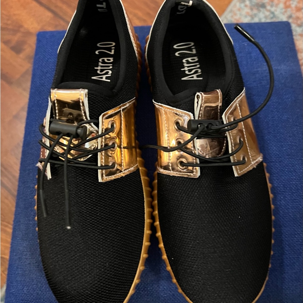 Woman’s Black and Gold Shoes